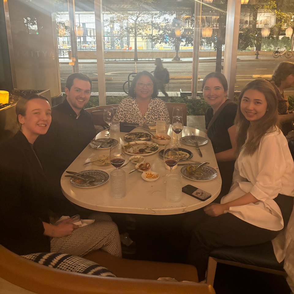 The lab members sitting at a restaurant